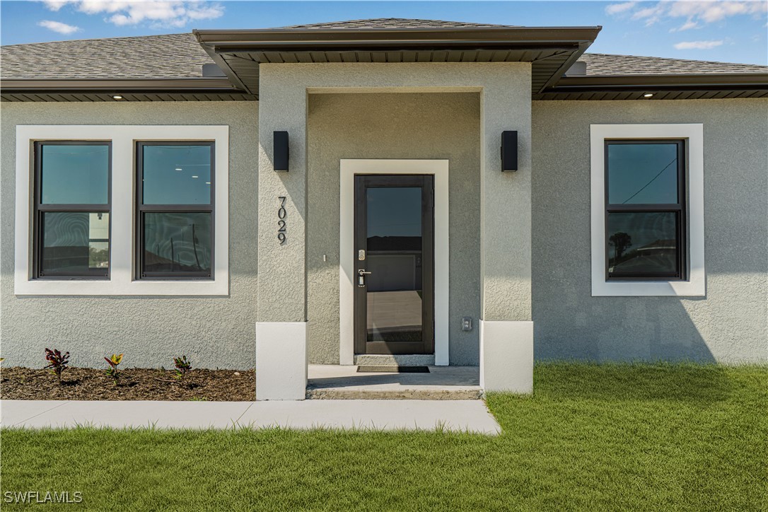 7029 Hero Court LaBelle, FL 33935 - Photo 3 of 36 a view of front door of house