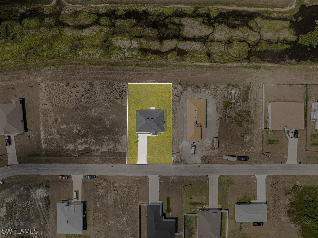 7029 Hero Court LaBelle, FL 33935 - Photo 36 of 36 a bathroom with a sink and a mirror