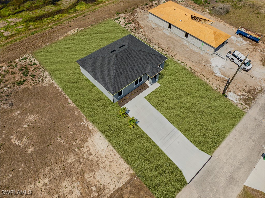 7029 Hero Court LaBelle, FL 33935 - Photo 7 of 36 an aerial view of a house with a yard basket ball court and outdoor seating