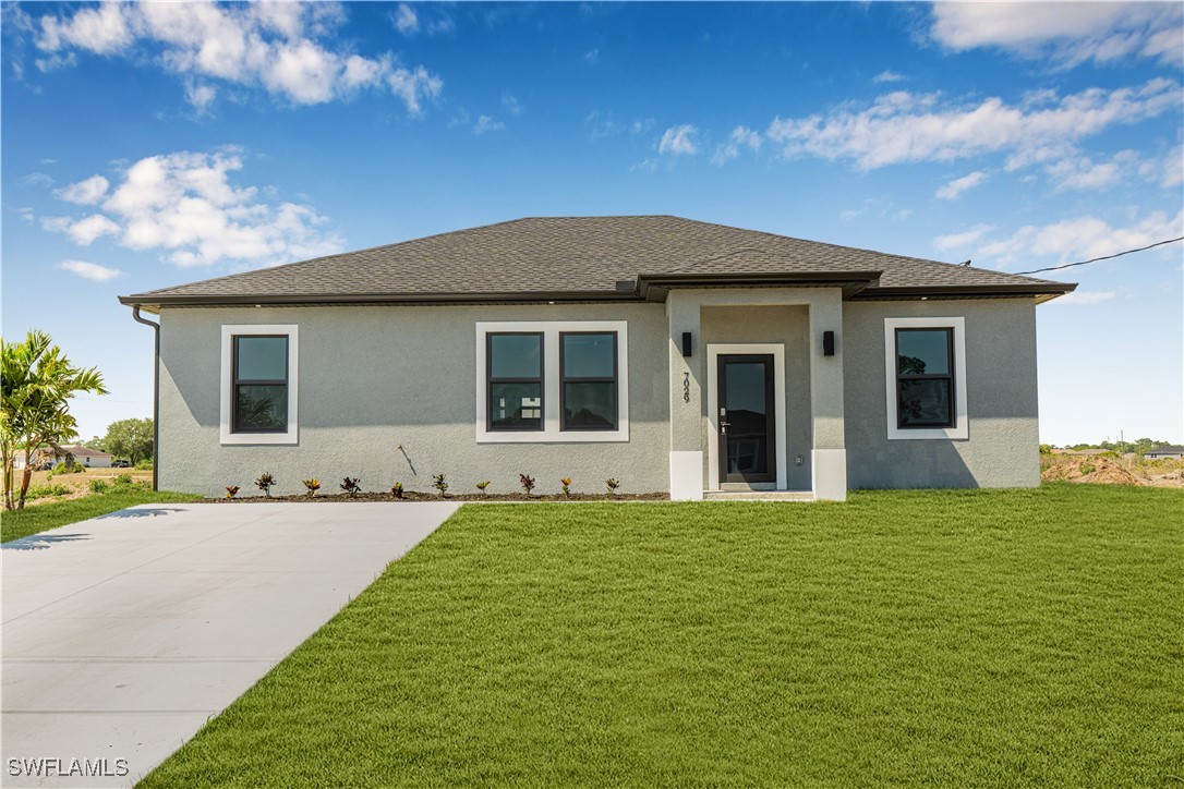 7029 Hero Court LaBelle, FL 33935 - Photo 8 of 36 a view of a house with a yard