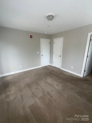a en suite bathroom with a sink a toilet a mirror and vanity