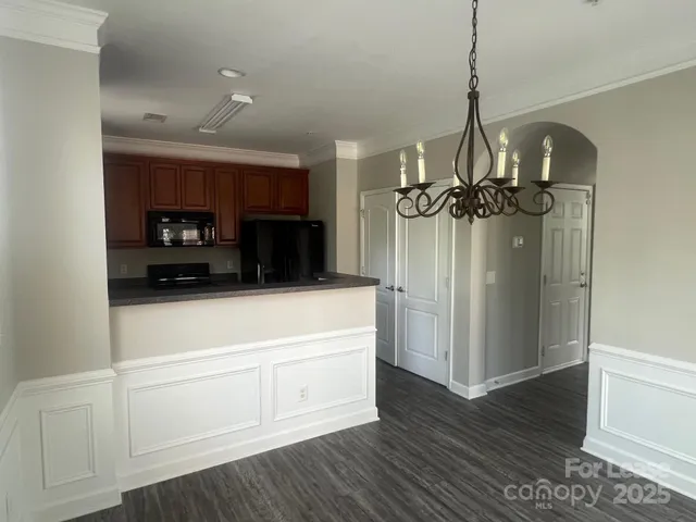 a view of a hallway with a chandelier