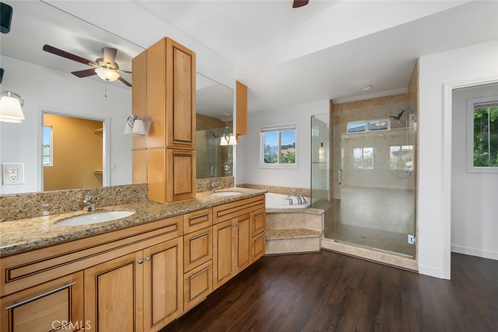6001 Joan Place San Luis Obispo, CA 93401 - Photo 22 of 56 a spacious bathroom with a granite countertop sink mirror and double