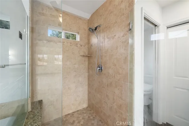 an aerial view of residential houses with outdoor space and street view