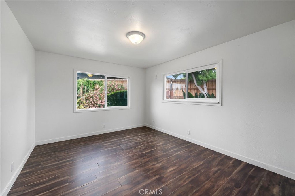 6001 Joan Place San Luis Obispo, CA 93401 - Photo 33 of 56 wooden floor in an empty room with a window