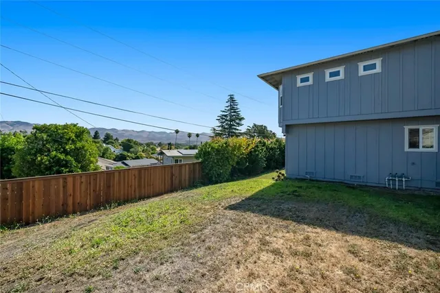 an aerial view of residential house with outdoor space and mountain view