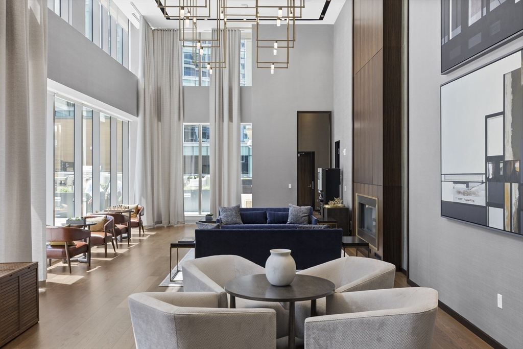 135 Seaport Boulevard, Unit 905 Boston, MA 02210 - Photo 18 of 21 a dining room with furniture and large windows