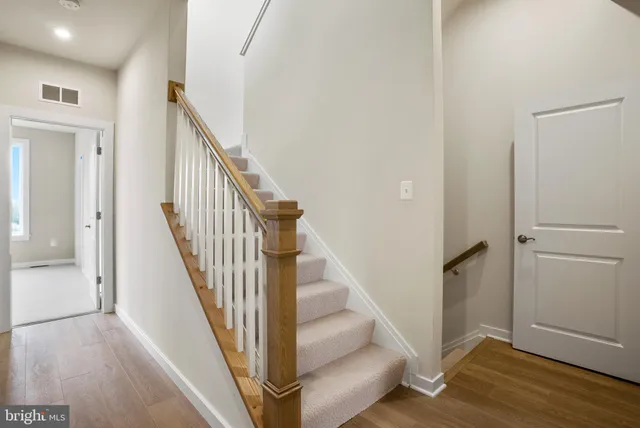 a view of an entryway with wooden floor