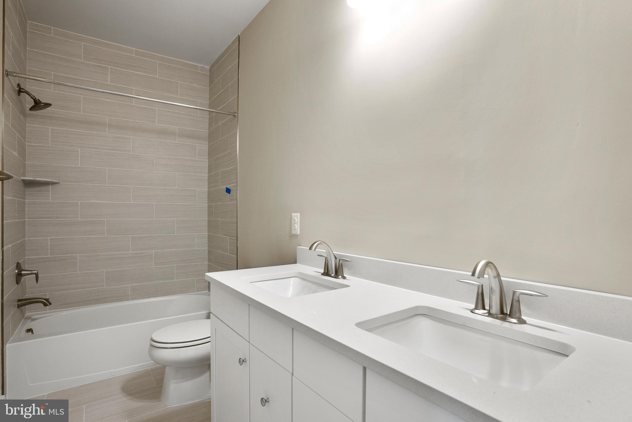 6717 Belcrest Road Hyattsville, MD 20782 - Photo 10 of 29 a bathroom with a sink toilet and shower