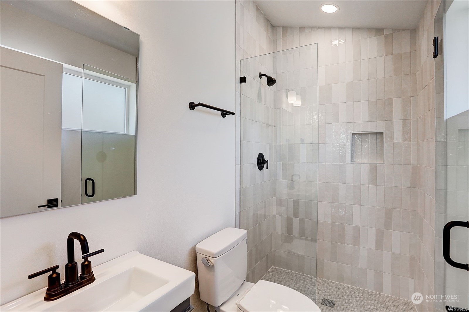 3221 Northeast 86th Street Seattle, WA 98115 - Photo 14 of 22 a bathroom with a sink toilet and shower