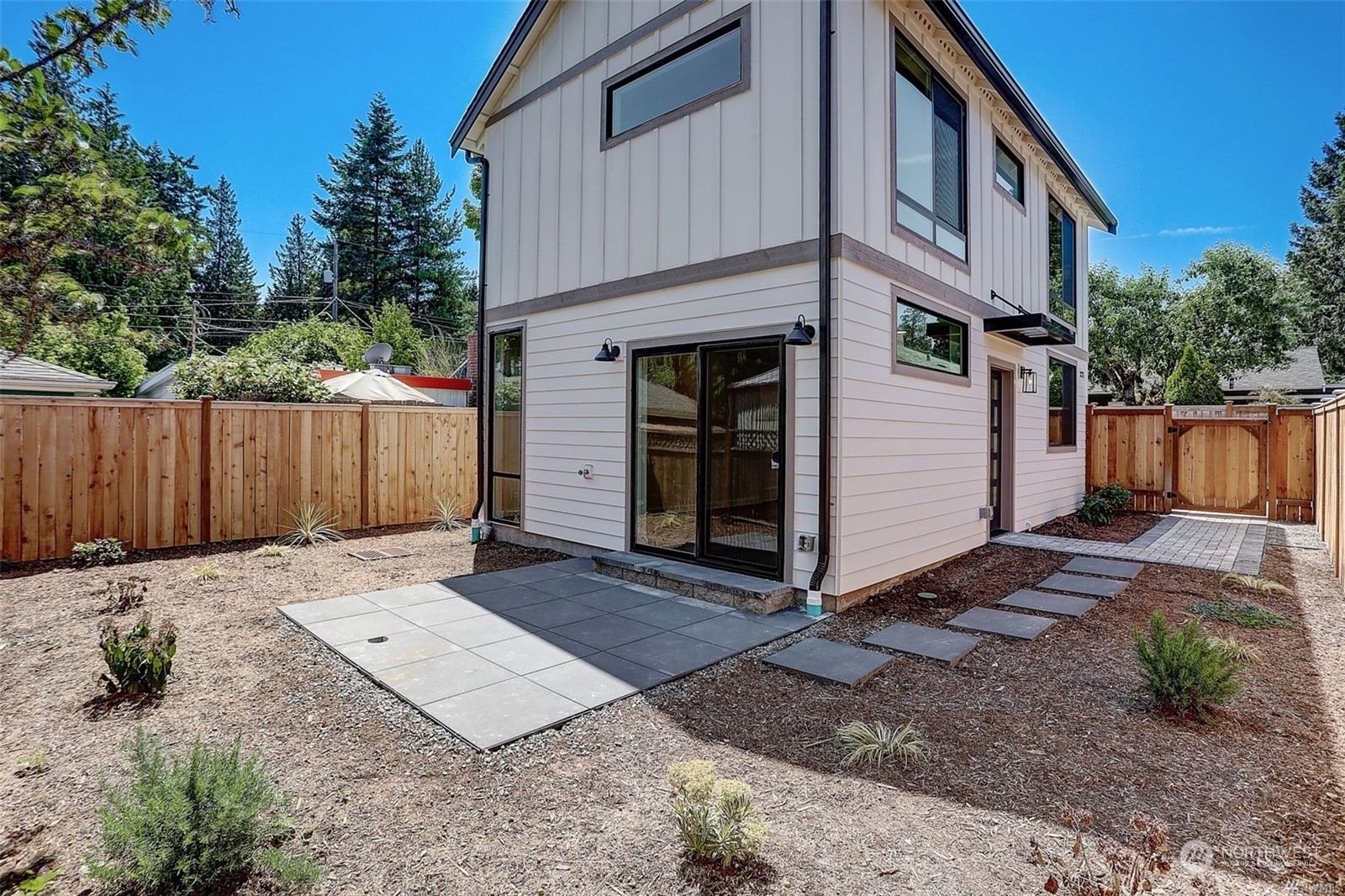 3221 Northeast 86th Street Seattle, WA 98115 - Photo 3 of 22 a backyard of a house