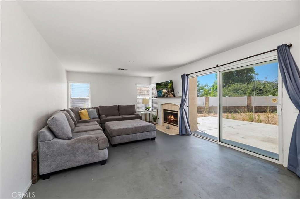 352 Leafwood Court Riverside, CA 92506 - Photo 11 of 42 a living room with furniture and a flat screen tv