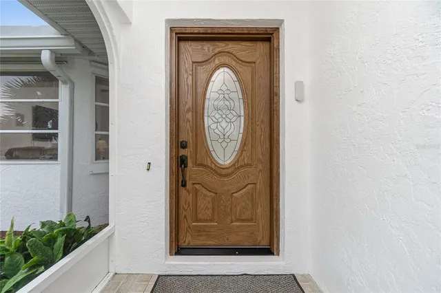 a front view of a door with wooden door