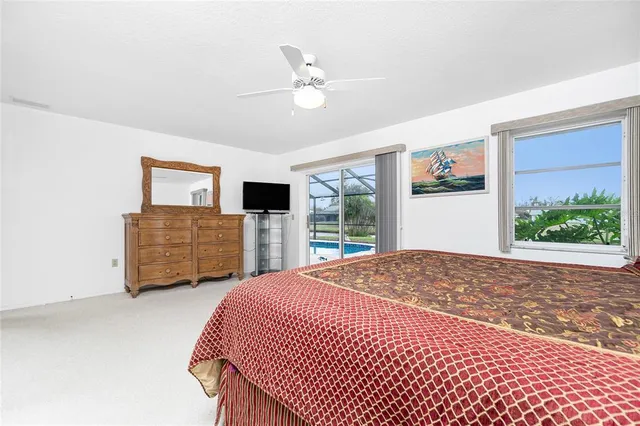 a bedroom with a bed dresser and a window