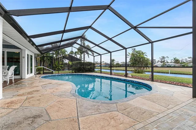 a view of indoor pool and sitting area