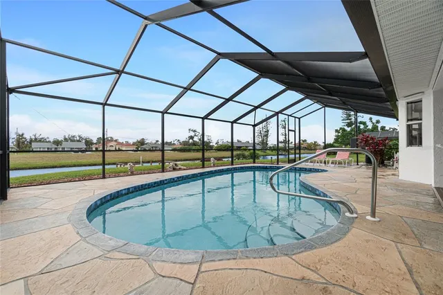 a view of a swimming pool with a porch