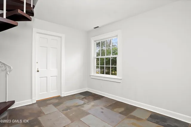 an empty room with windows