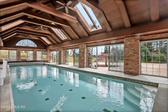 a view of a swimming pool with a yard