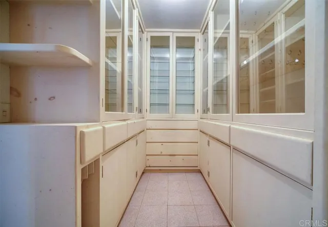 a view of walk in closet with window