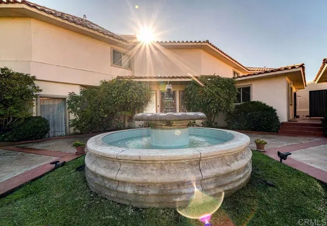 a view of a house with a backyard