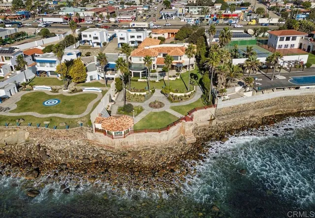 an aerial view of residential houses with outdoor space