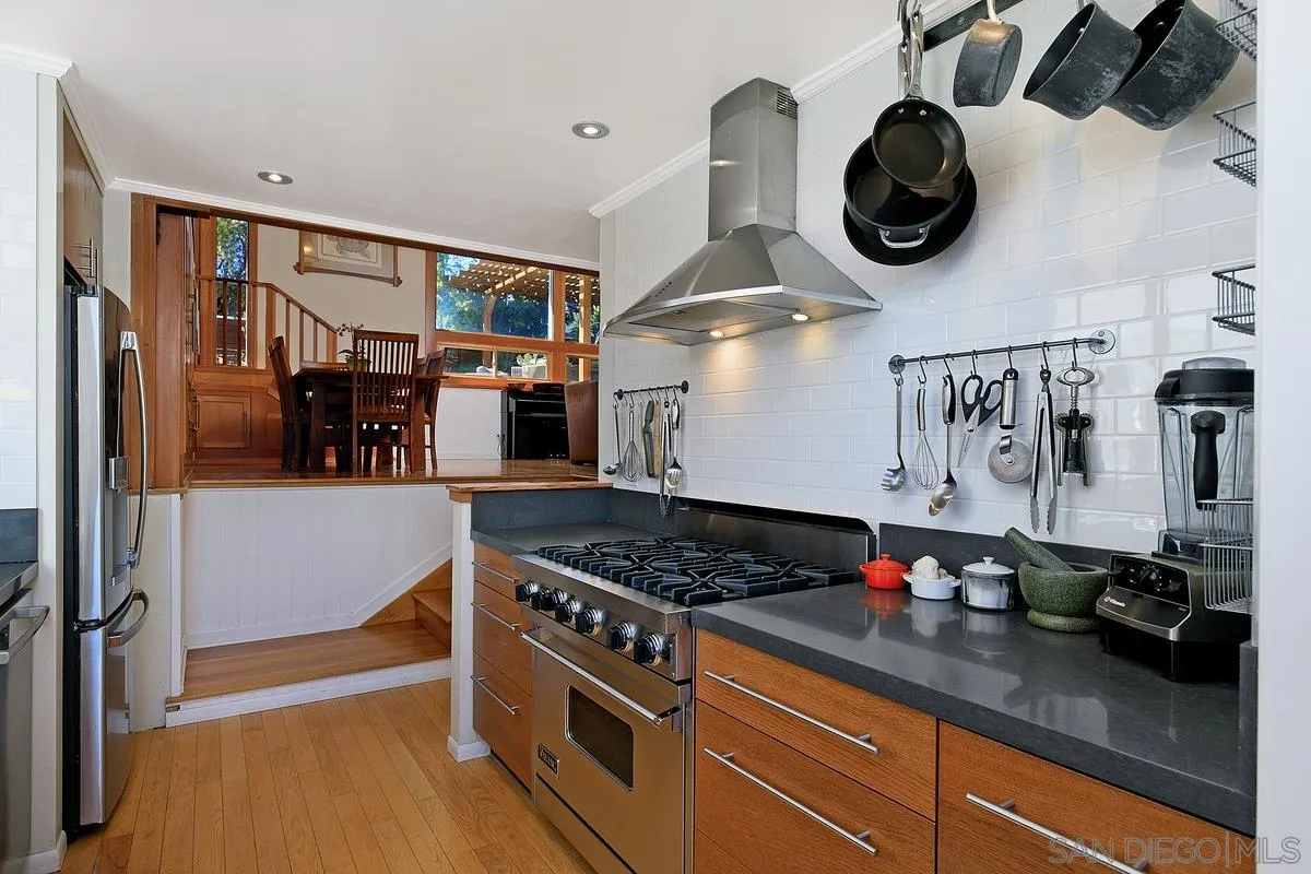 345 Neptune Avenue Encinitas, CA 92024 - Photo 11 of 29 a kitchen with a stove and cabinets