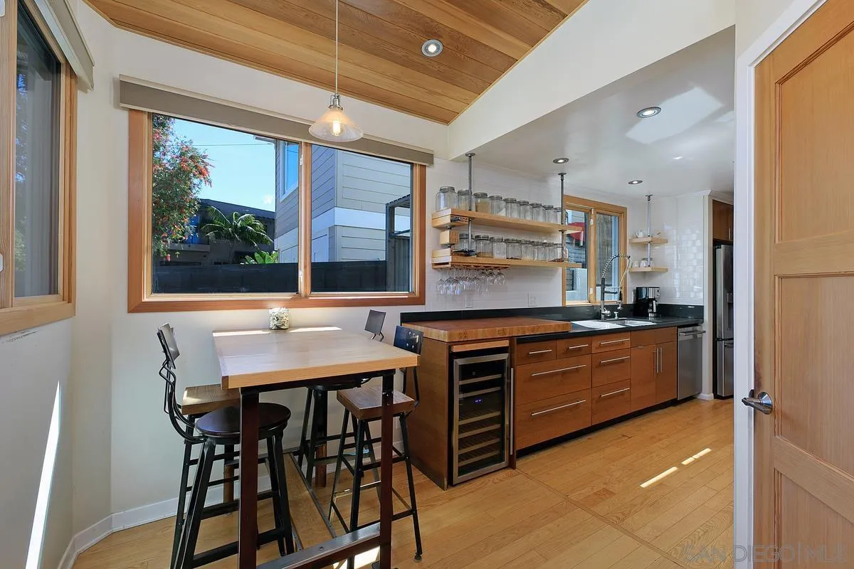 345 Neptune Avenue Encinitas, CA 92024 - Photo 12 of 29 a kitchen with a stove a sink and a refrigerator