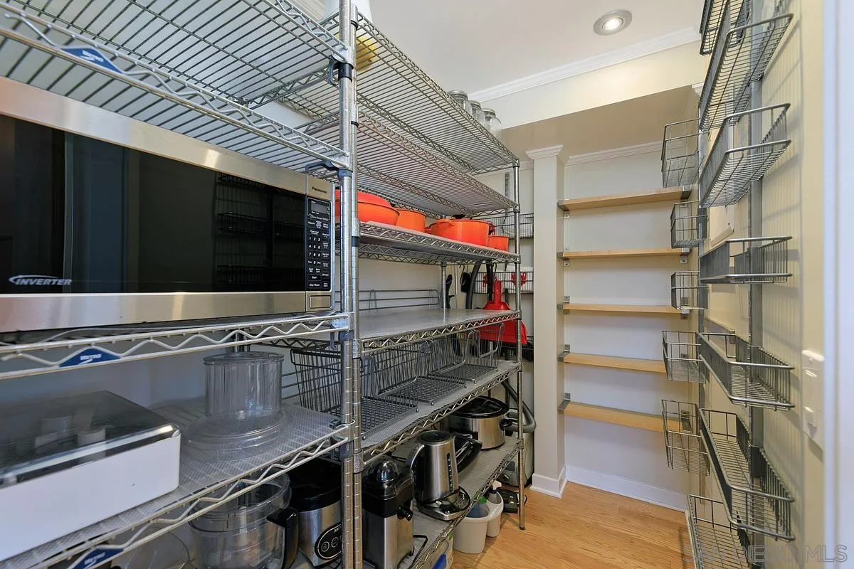 345 Neptune Avenue Encinitas, CA 92024 - Photo 13 of 29 a kitchen with stainless steel appliances and cabinets