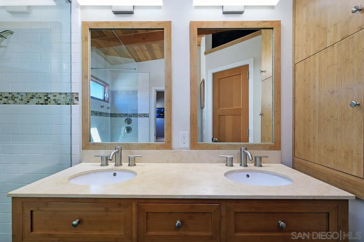 345 Neptune Avenue Encinitas, CA 92024 - Photo 18 of 29 a bathroom with a sink and a mirror