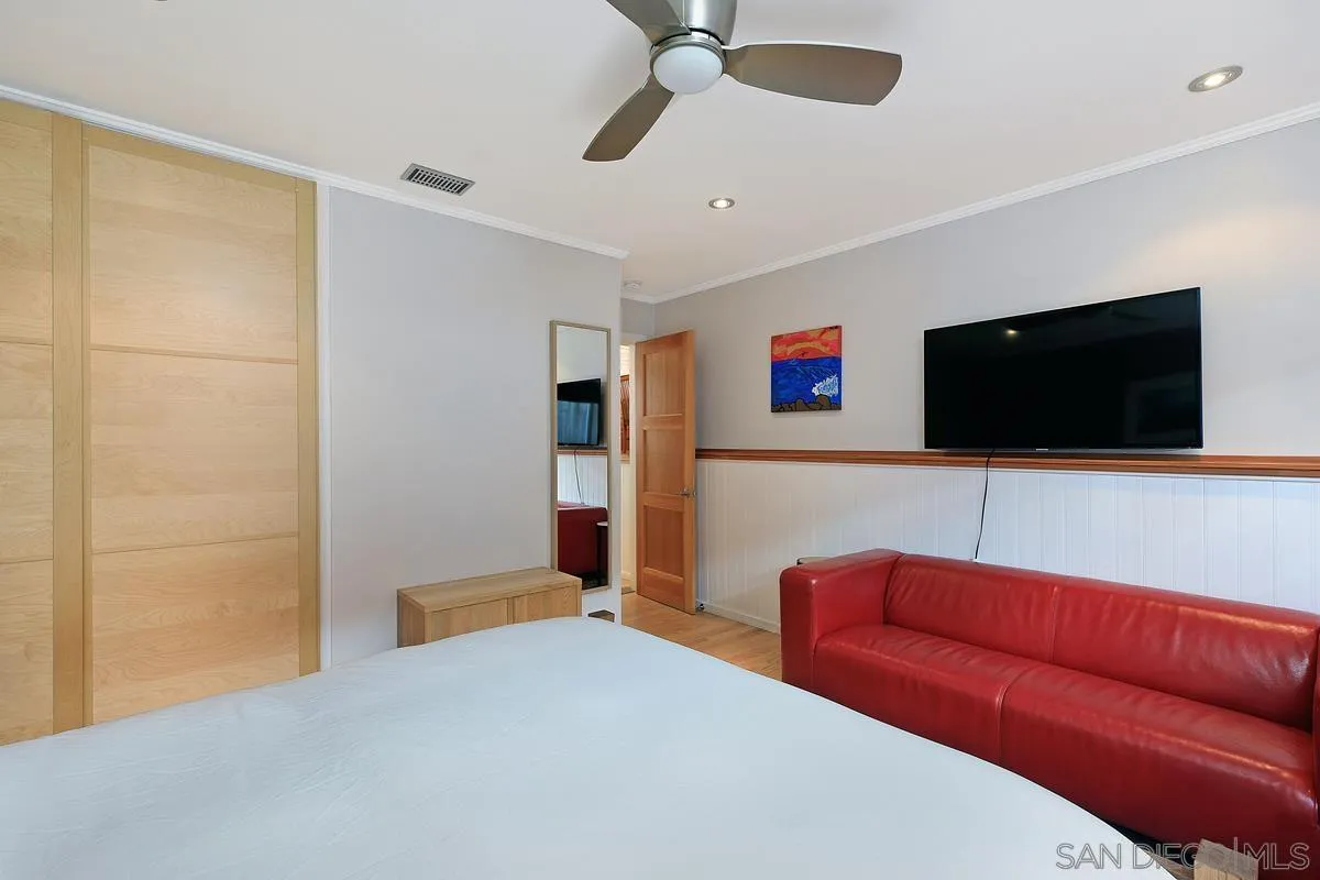 345 Neptune Avenue Encinitas, CA 92024 - Photo 20 of 29 a living room with furniture and a flat screen tv