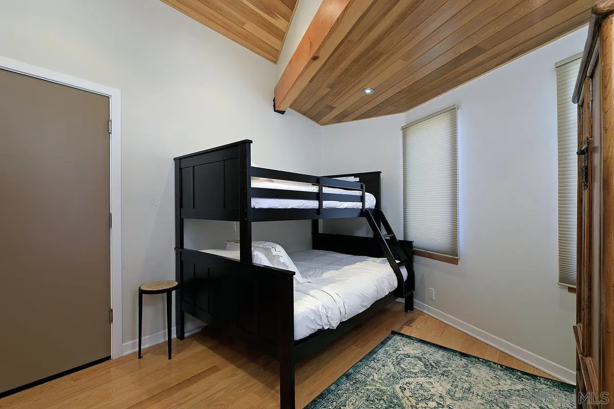 345 Neptune Avenue Encinitas, CA 92024 - Photo 22 of 29 a bedroom with bed and a window