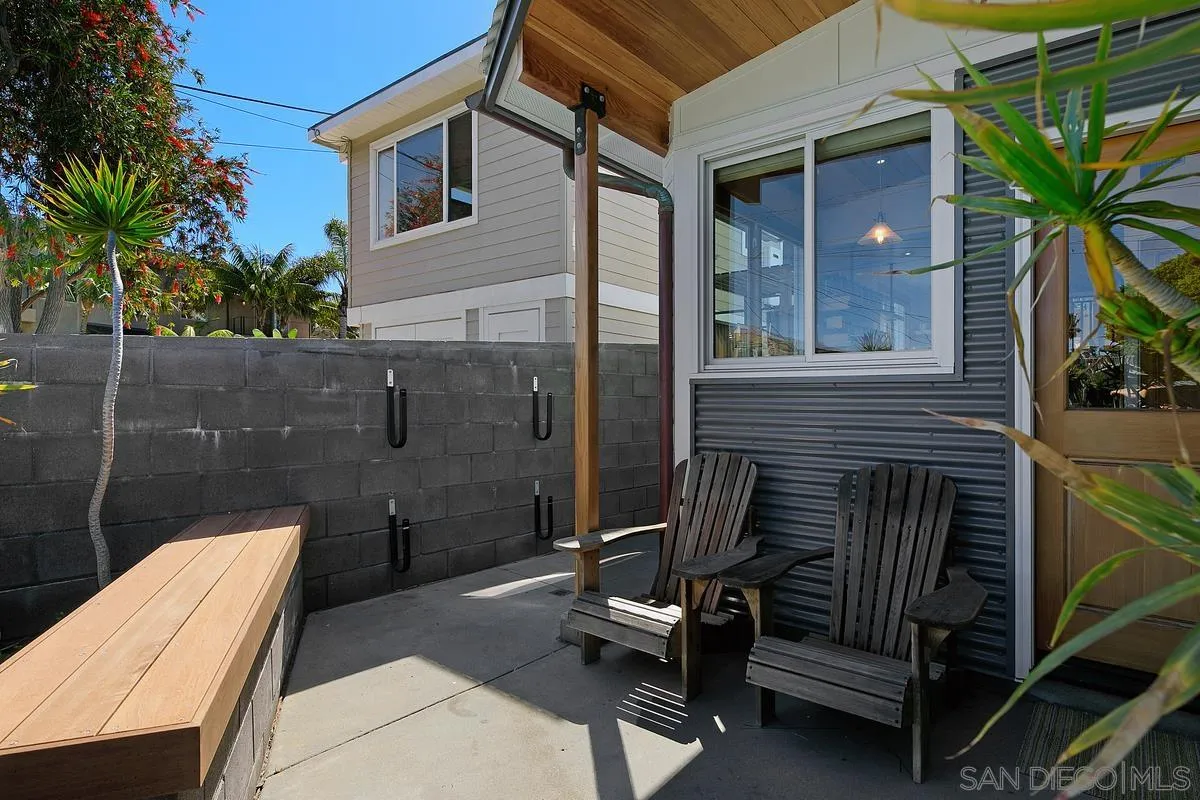 345 Neptune Avenue Encinitas, CA 92024 - Photo 27 of 29 a view of backyard with wheel chair and potted plants