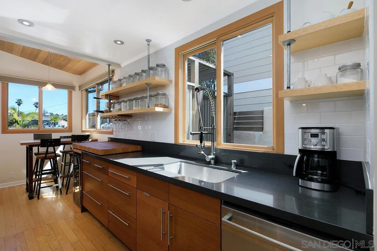 345 Neptune Avenue Encinitas, CA 92024 - Photo 10 of 29 a kitchen with a sink and stove