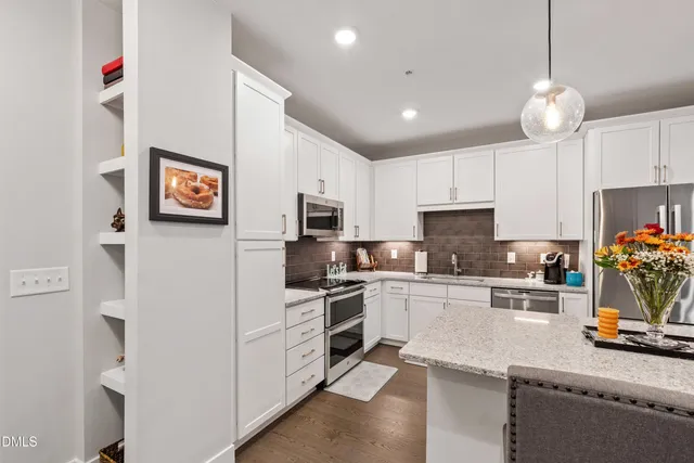 a room with cabinets and a wooden floor