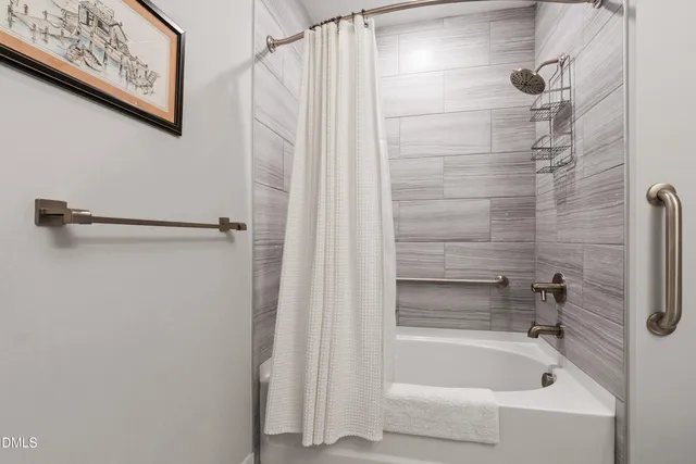 a view of a patio with table and chairs potted plants and a palm tree