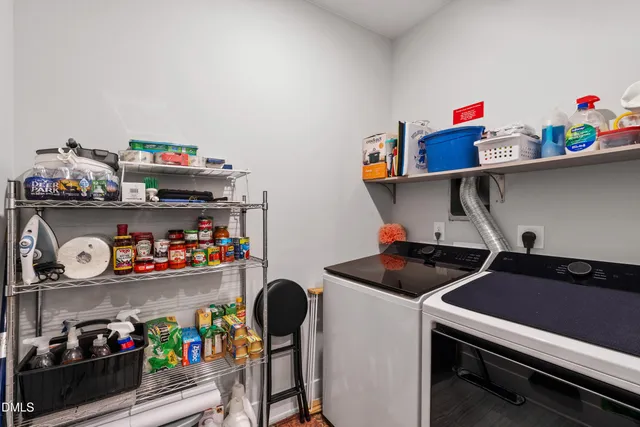 a building outdoor space with patio furniture and potted plants
