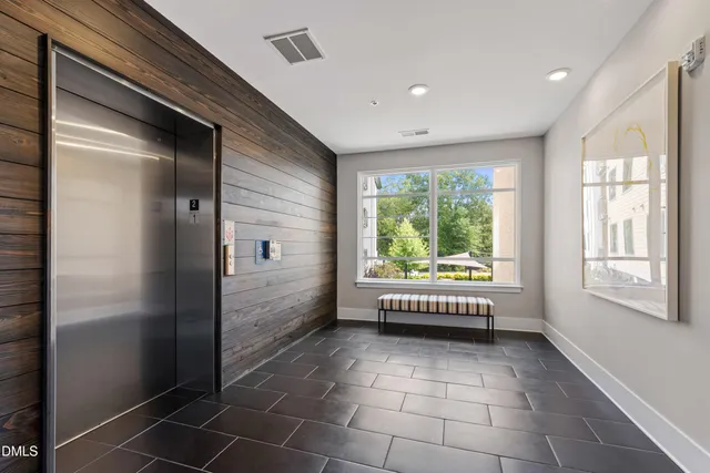 a view of an entryway with wooden floor and windows