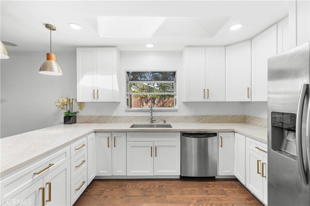 26096 Adamor Road Calabasas, CA 91302 - Photo 22 of 61 Kitchen has tremendous cabinet storage and counter space, and a window box that overlooks the garden and fountain.