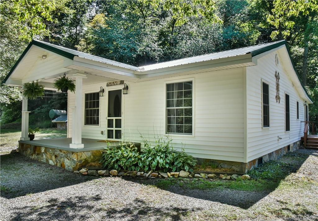 6295 Crabtree Road Clyde, NC 28721 - Photo 2 of 37 a front view of a house with a yard