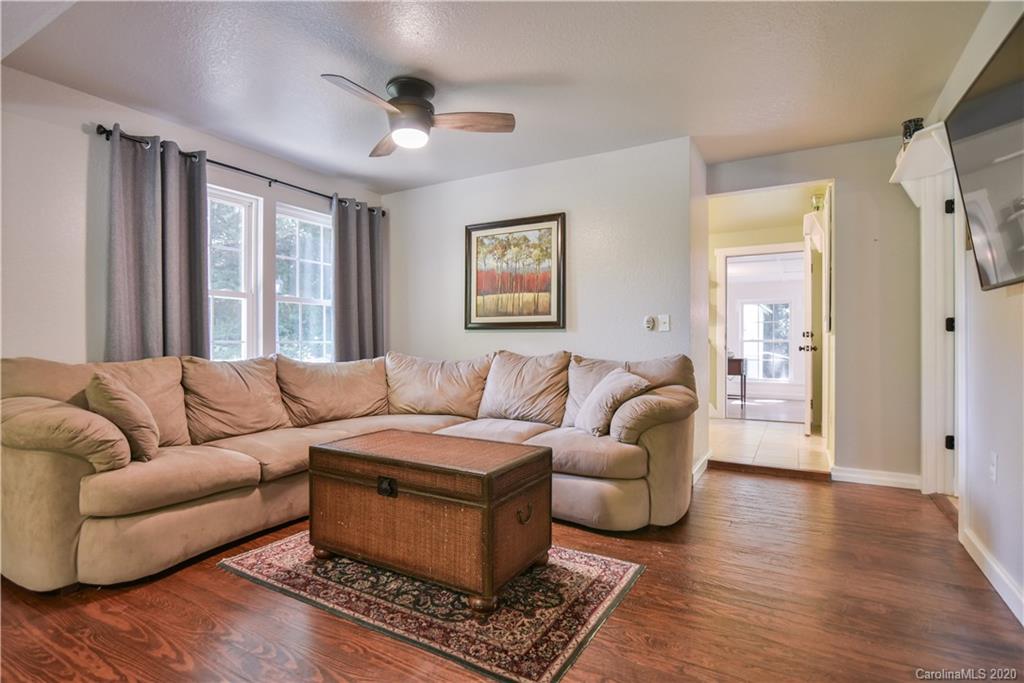 6295 Crabtree Road Clyde, NC 28721 - Photo 24 of 37 a living room with furniture and a window
