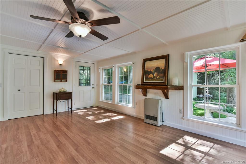 6295 Crabtree Road Clyde, NC 28721 - Photo 30 of 37 a view of a livingroom with furniture window and wooden floor