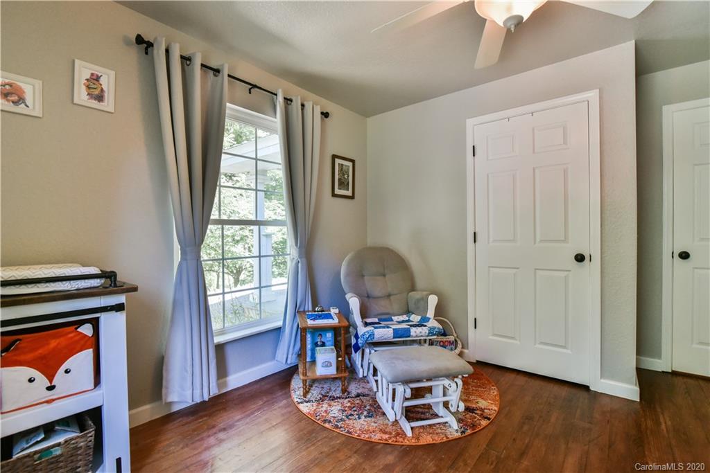 6295 Crabtree Road Clyde, NC 28721 - Photo 34 of 37 a living room with furniture and a window