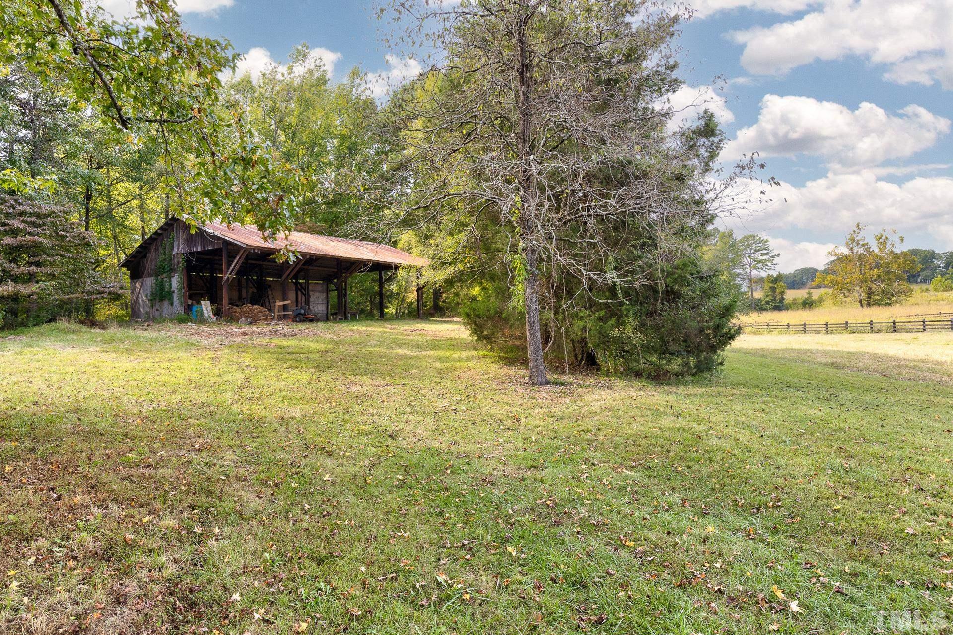 6518 New Sharon Church Road Rougemont, NC 27572 - Photo 26 of 29 a view of a house with a yard and sitting area