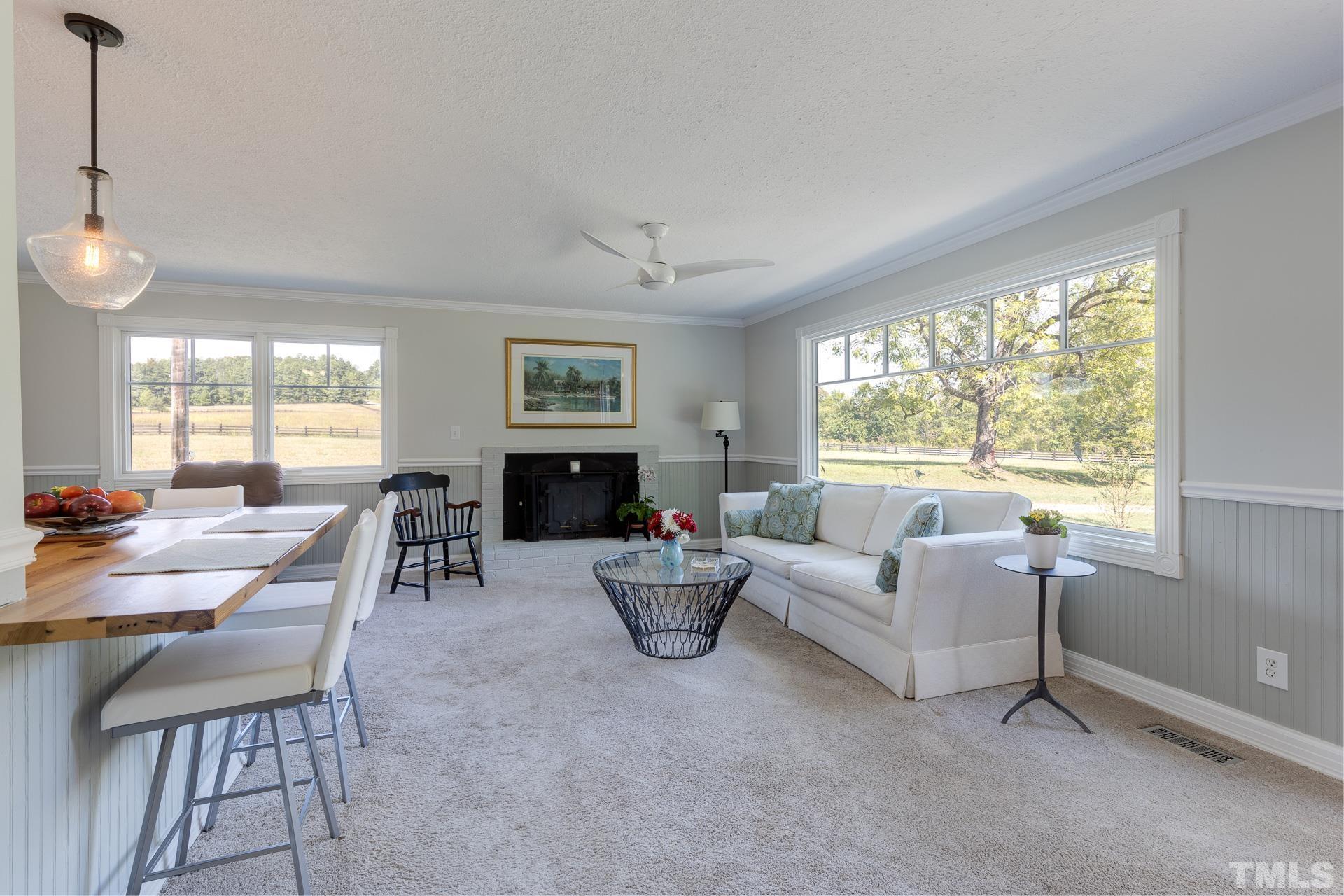 6518 New Sharon Church Road Rougemont, NC 27572 - Photo 4 of 29 a living room with furniture and a large window