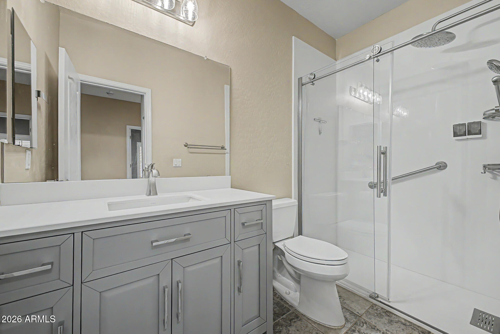 2600 East Springfield Place, Unit 109 Chandler, AZ 85286 - Photo 22 of 38 a bathroom with a sink a toilet and shower