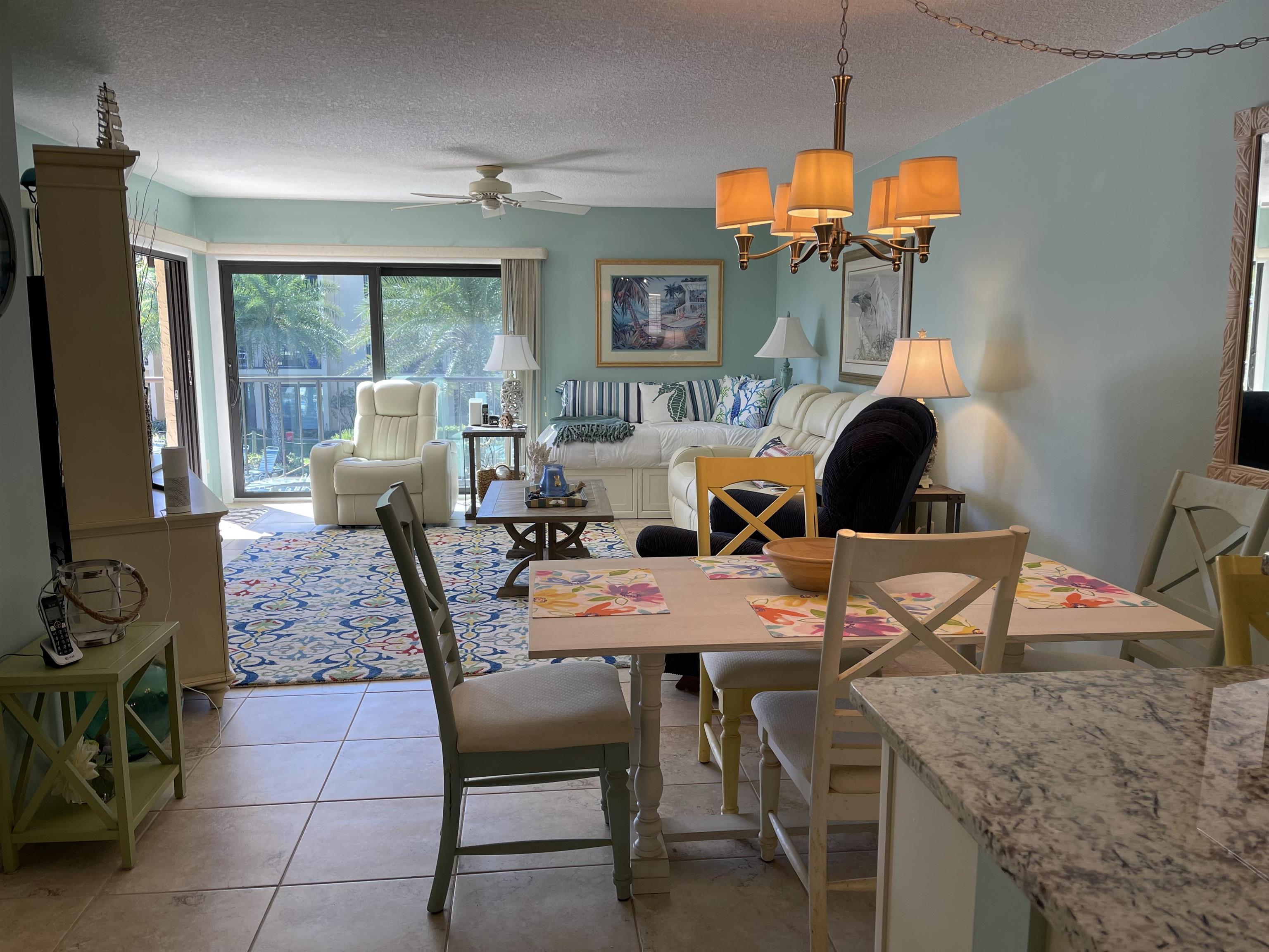 213 Pacifica Vista Way St. Augustine, FL 32080 - Photo 11 of 29 a dining room with furniture a chandelier and window