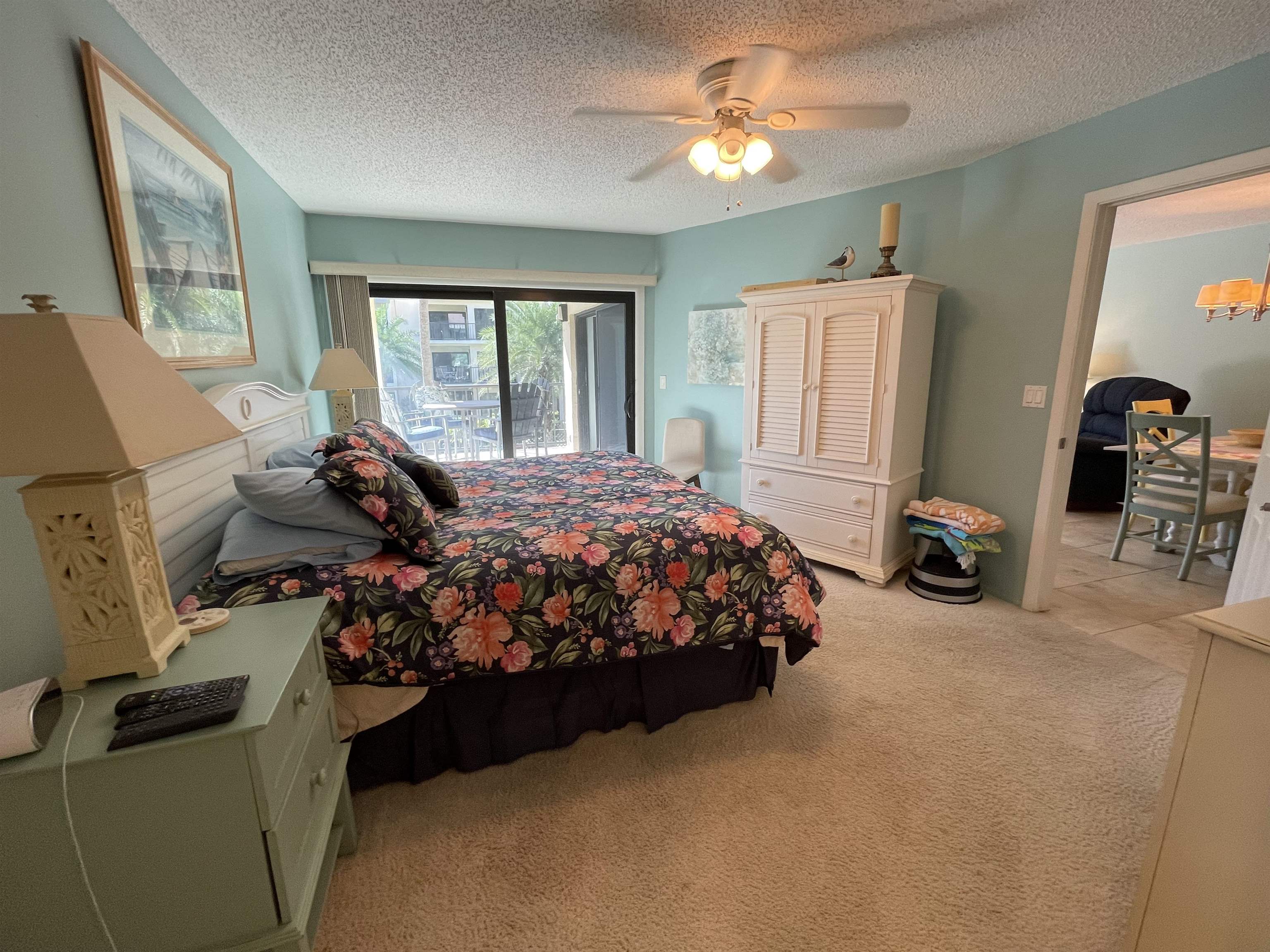 213 Pacifica Vista Way St. Augustine, FL 32080 - Photo 22 of 29 a bed sitting in a bedroom next to a window