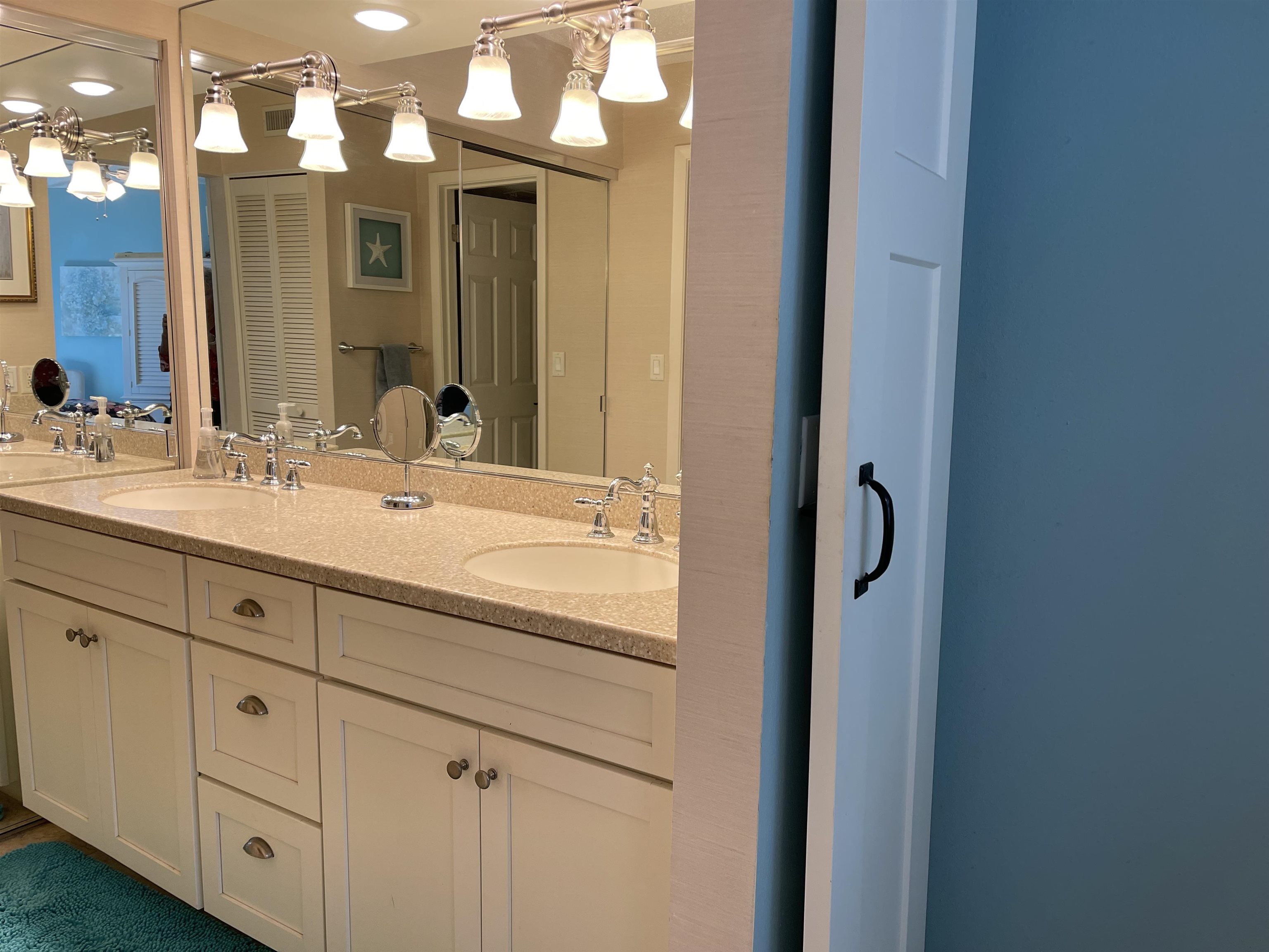 213 Pacifica Vista Way St. Augustine, FL 32080 - Photo 23 of 29 a bathroom with a sink vanity and a mirror