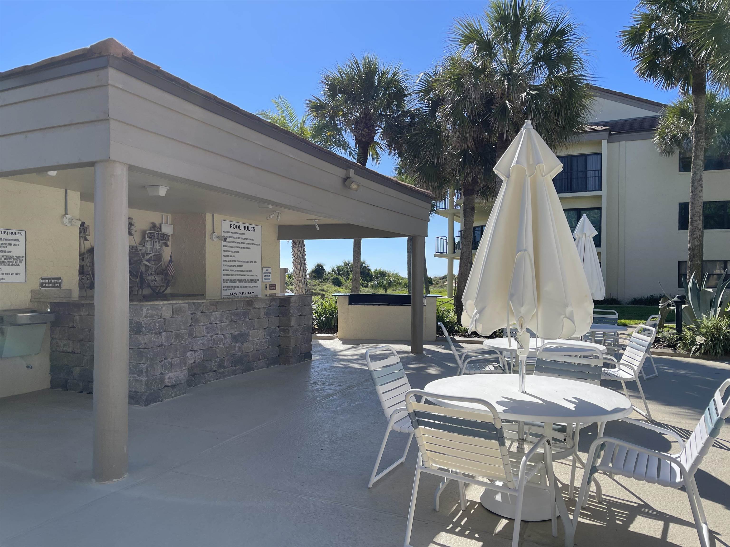 213 Pacifica Vista Way St. Augustine, FL 32080 - Photo 5 of 29 a view of a dinning table and chairs in patio