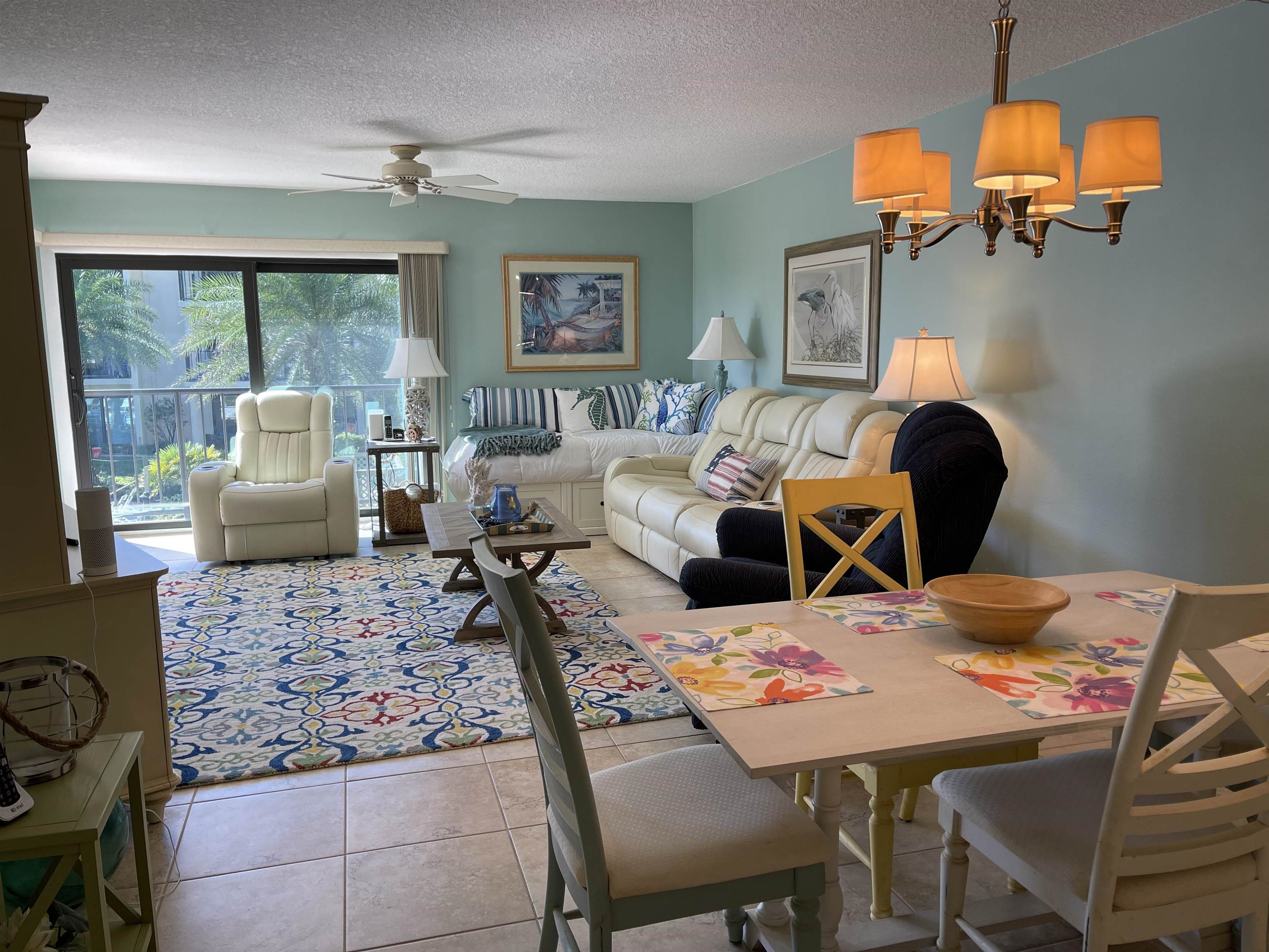 213 Pacifica Vista Way St. Augustine, FL 32080 - Photo 10 of 29 a living room with furniture fireplace and a large window